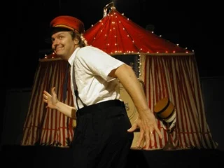 will be here to entertain all ages! This show gives everyone an opportunity to participate in an enthralling, whimsical celebration of the imagination. This show has been performed over 500 times around the globe. When Kevin opens his suitcase an entire circus emerges: tent, band, lights, the boisterous ringmaster Steve Fitzpatrick, the officious Mervin Merkle, the incredible Bumbilini Family, the Magician to the Stars Clyde Zerbini, and Keefer–an innocent trying to runaway and join the circus. However, the most important performers emerge from the audience. Free as always.