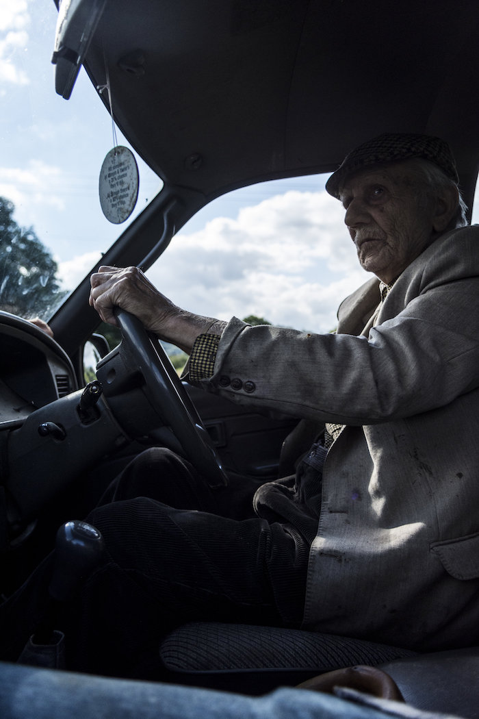 Taid driving the pickup watching over his flock at the age of 95.