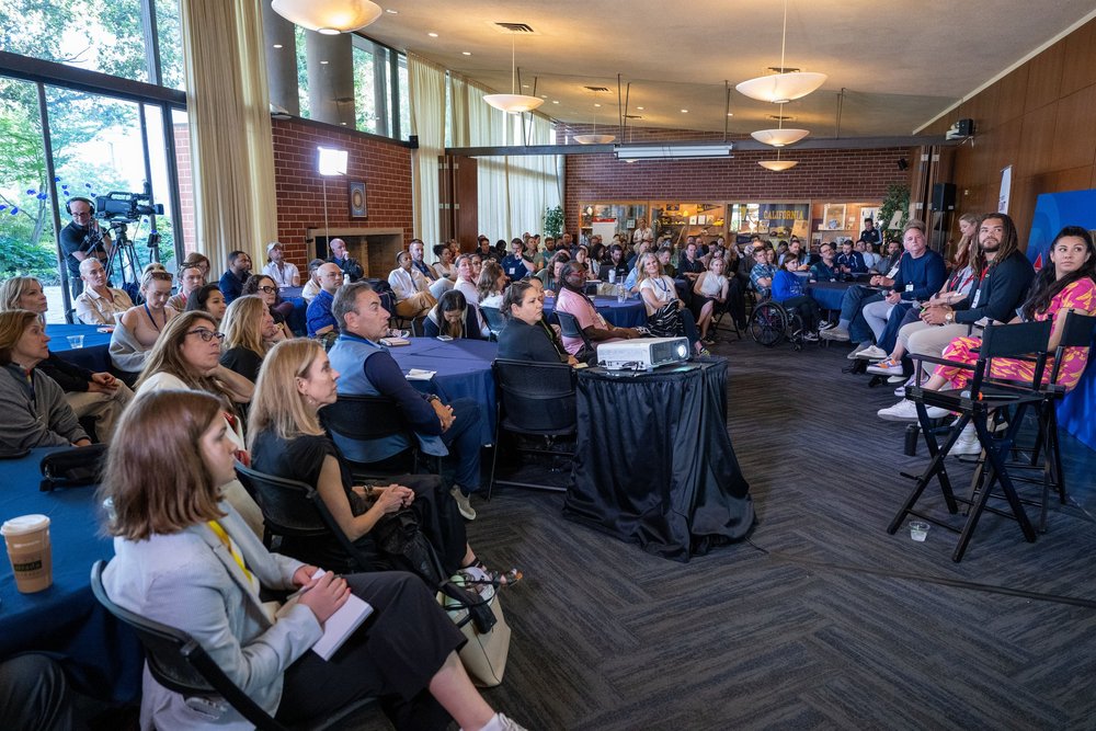 Meet the Disruptors panel and audience.jpeg