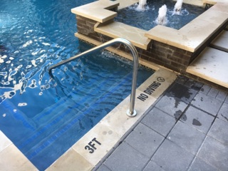 Engraved pool depth markers