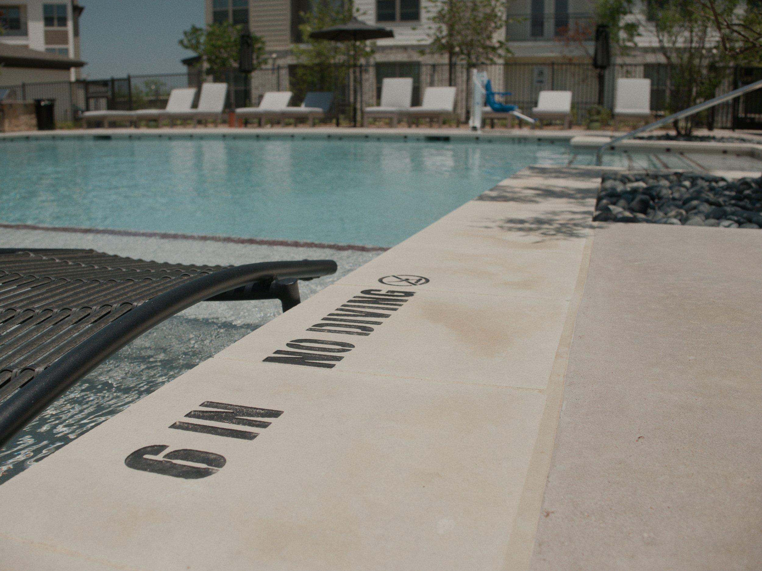 Engraved pool depth markers