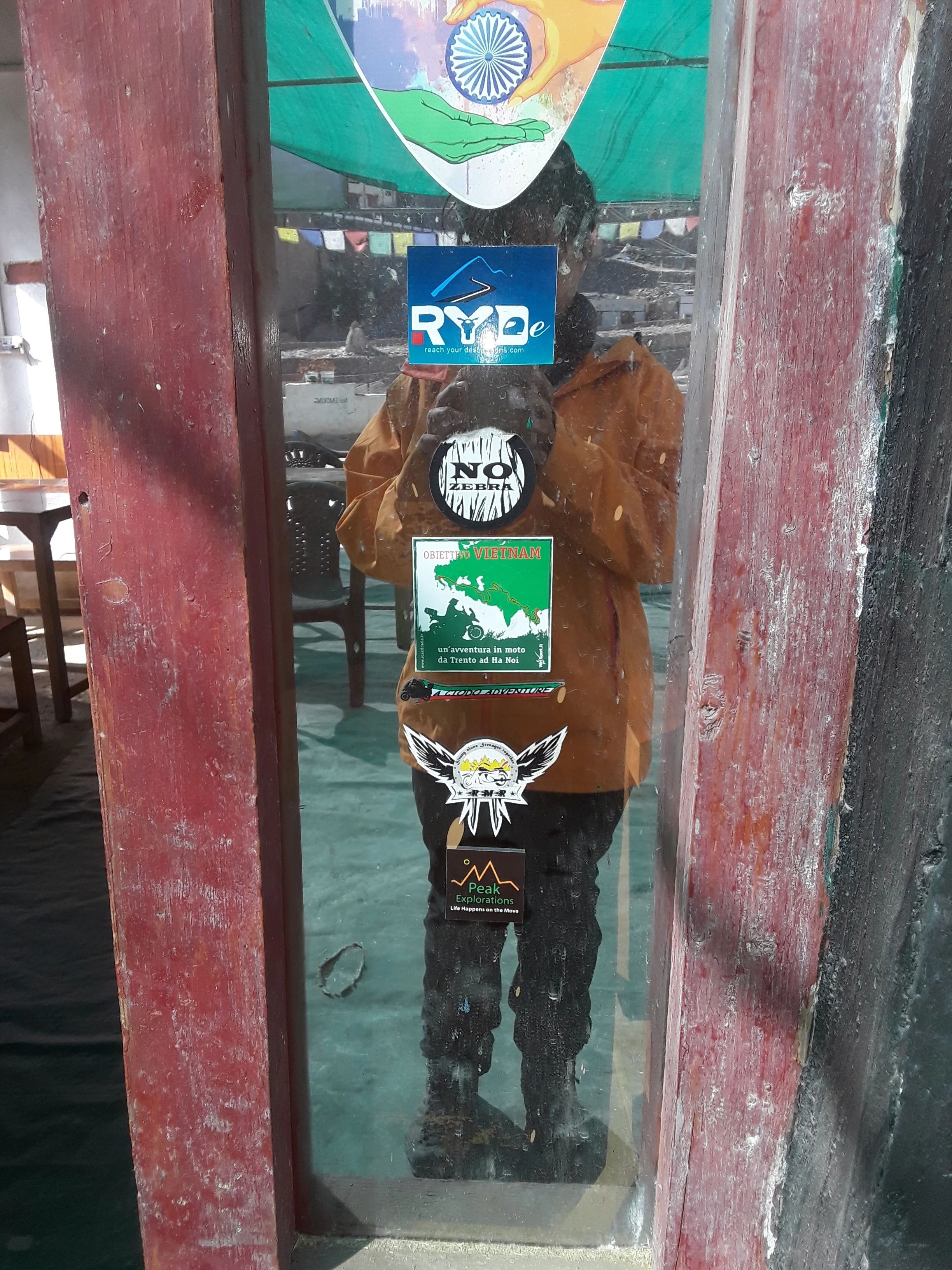PEAK EXPLORATIONS - my social enterprise has been added to the slew of stickers in Lamayuru.