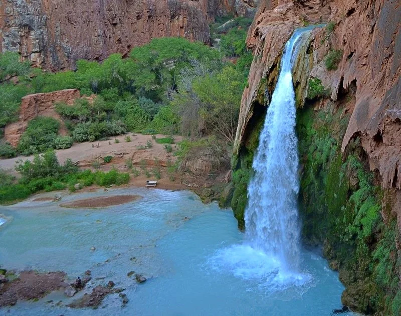 Havasu Falls, Arizona: A truly amazing place on earth where blue water falls over the red limestone cliffs of the Grand Canyon. This was the first adventure my husband and I went on when we were dating.
