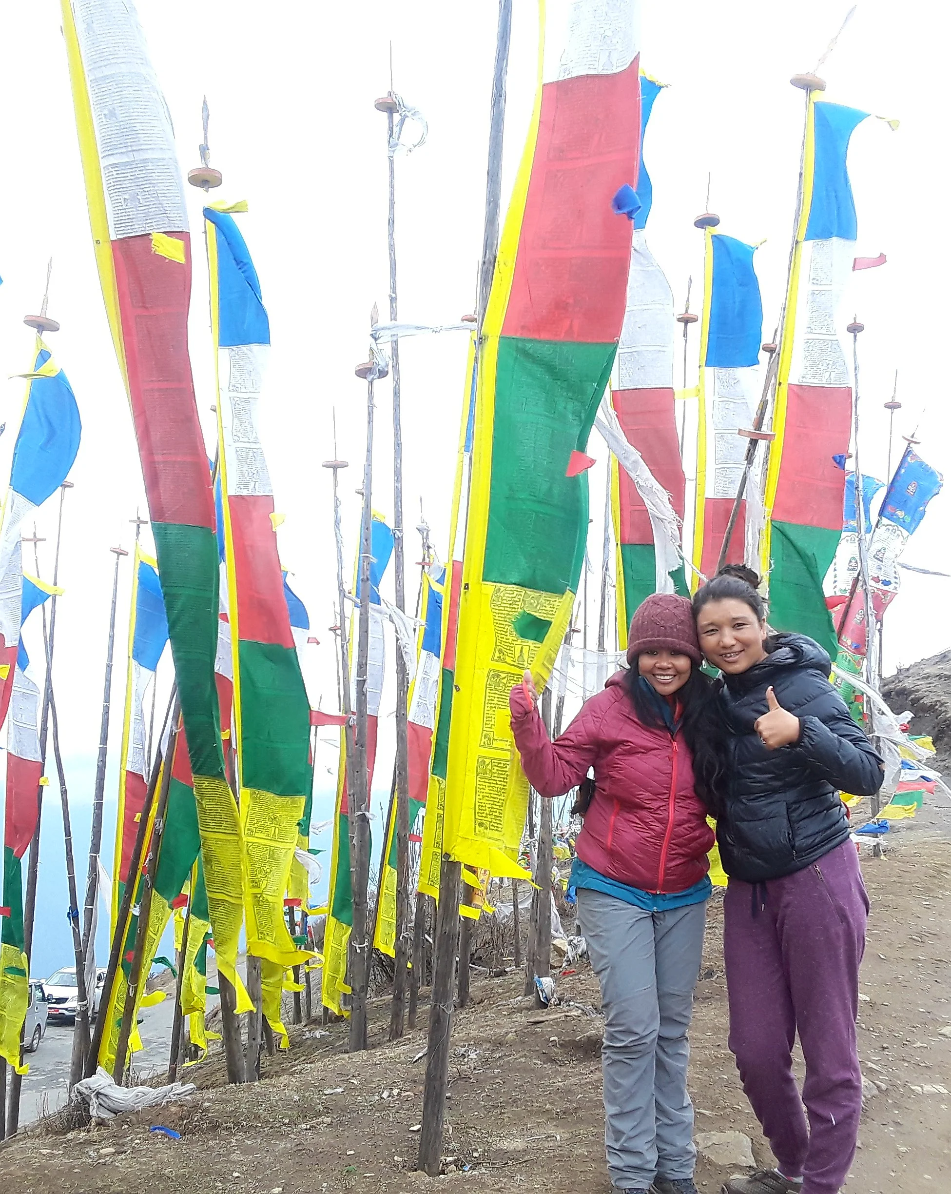 Dawa and I checking out the highest motorable pass in Bhutan, Chele La.