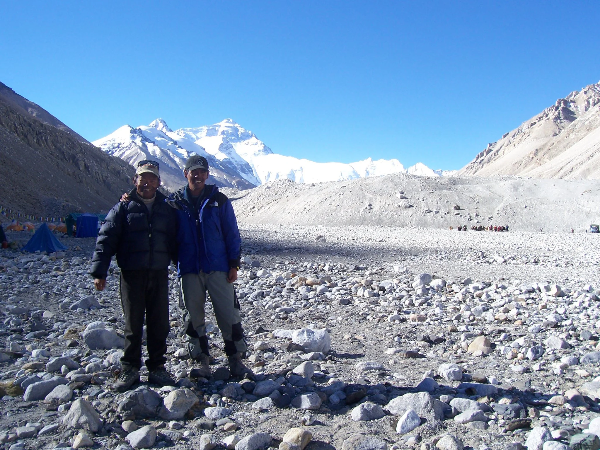 Regie with his climbing Sherpa partner after a successful summit of Everest in Tibet.