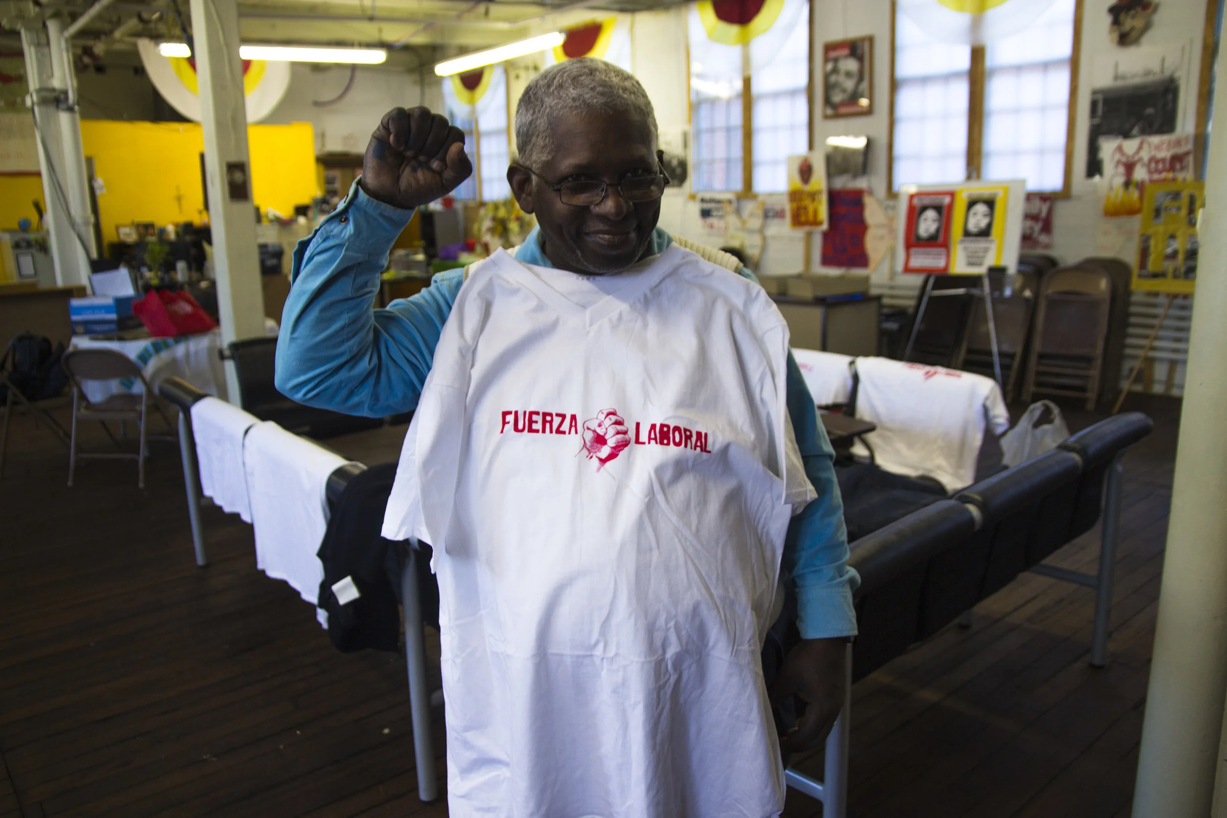 Participant with screen-printed shirt at Fuerza workshop