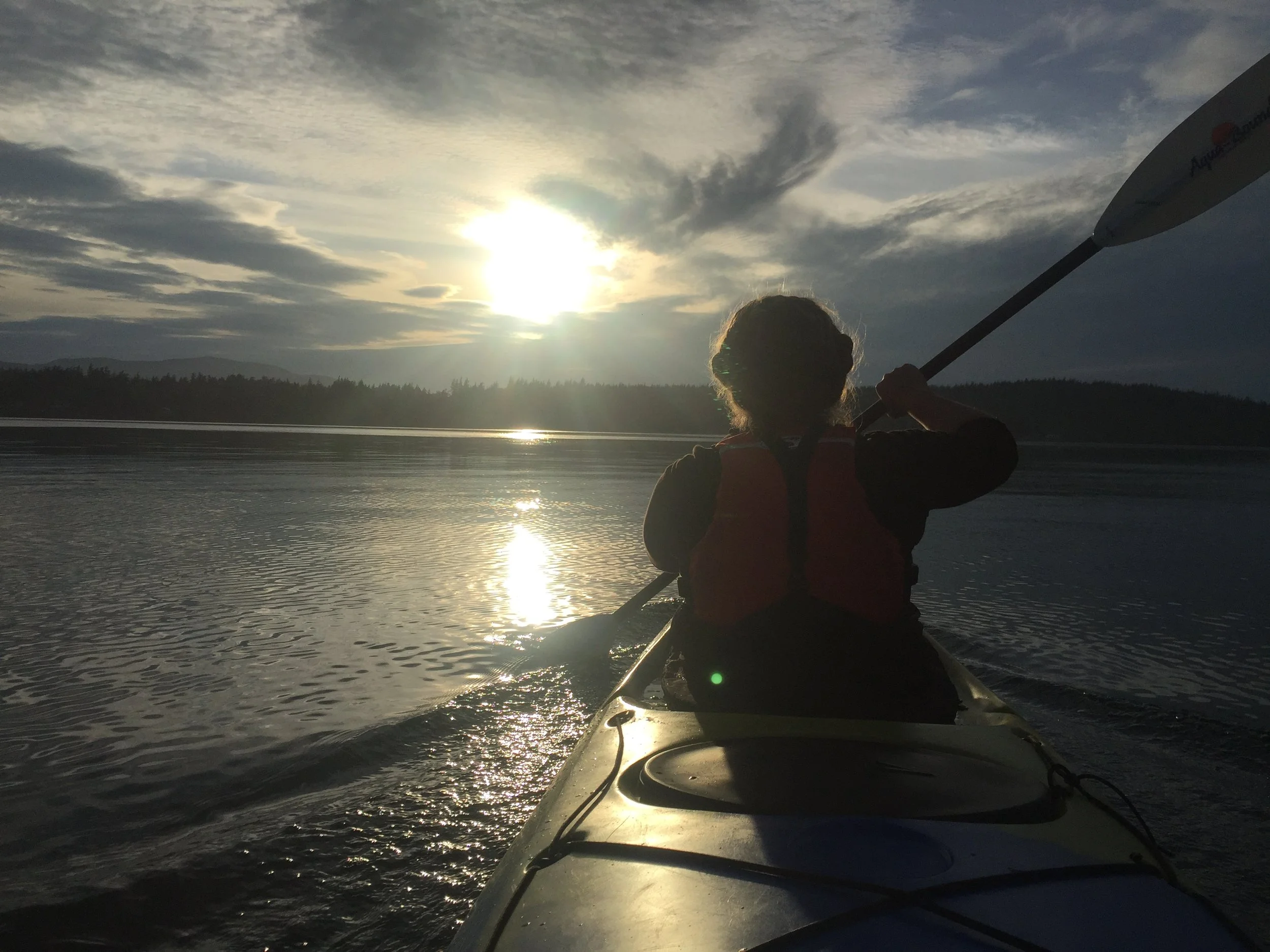 Author, mary dejong, heading west from the mainland across the salish sea on the autumn equinox