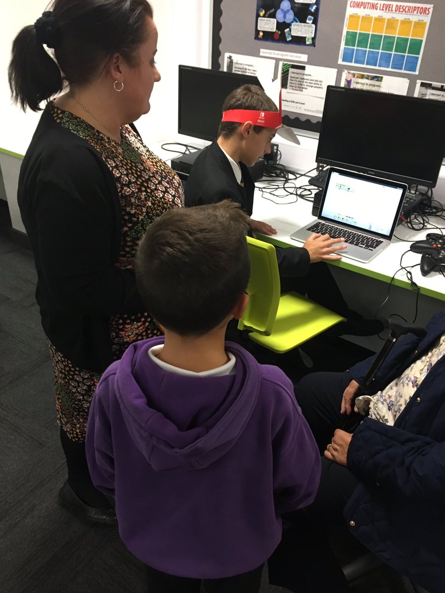 "Digital Leaders taking a break playing Mario Kart with their hats on. Team Luigi or Team Mario? Vote now!!"