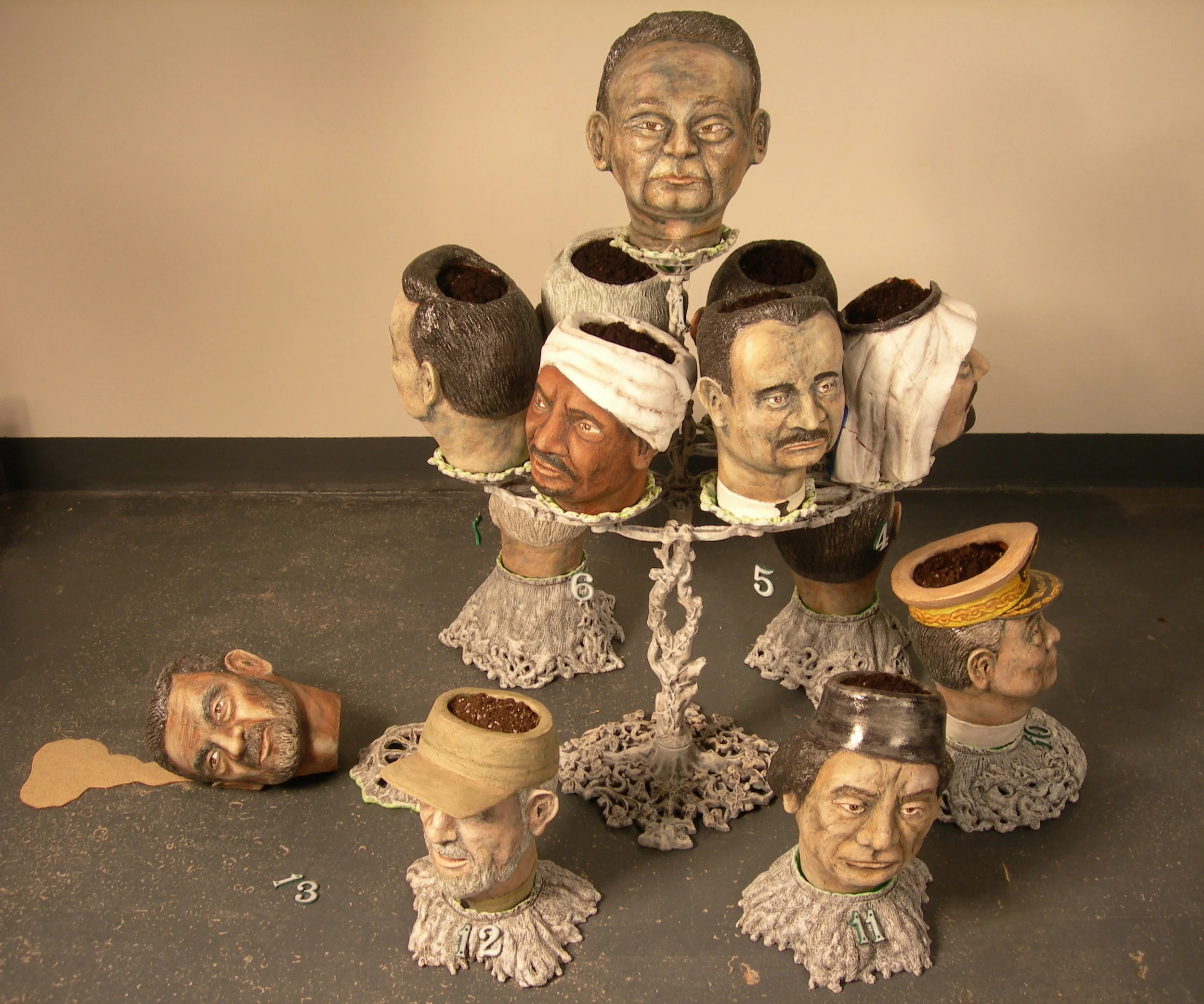 Despots, 48″W x 36″D x 45″H, stoneware, cast iron, soil, sand, 2008