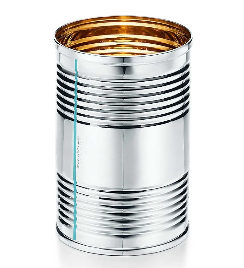 The Tiffany tin can conjures Andy Warhol's Campbell's Soup.