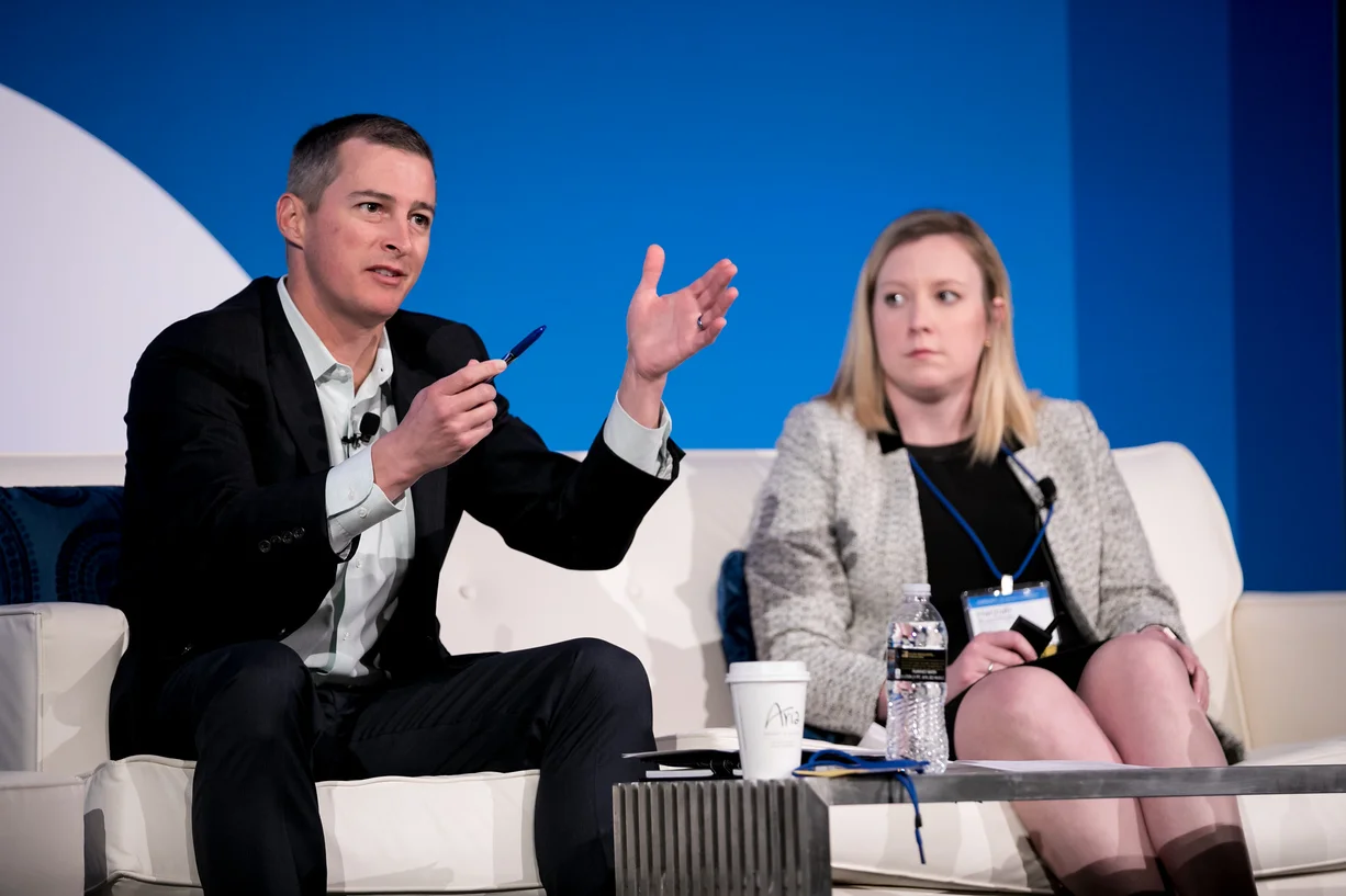 Justin Anderson (left) and Hannah Buschbom (right) presenting “BUILDING CENTERS OF INFLUENCE and Creating a Collaborative Network for Female Leaders” at Barron’s Top Advisory Teams Summit in Las Vegas, NV. Photo Credit: LILA PHOTO