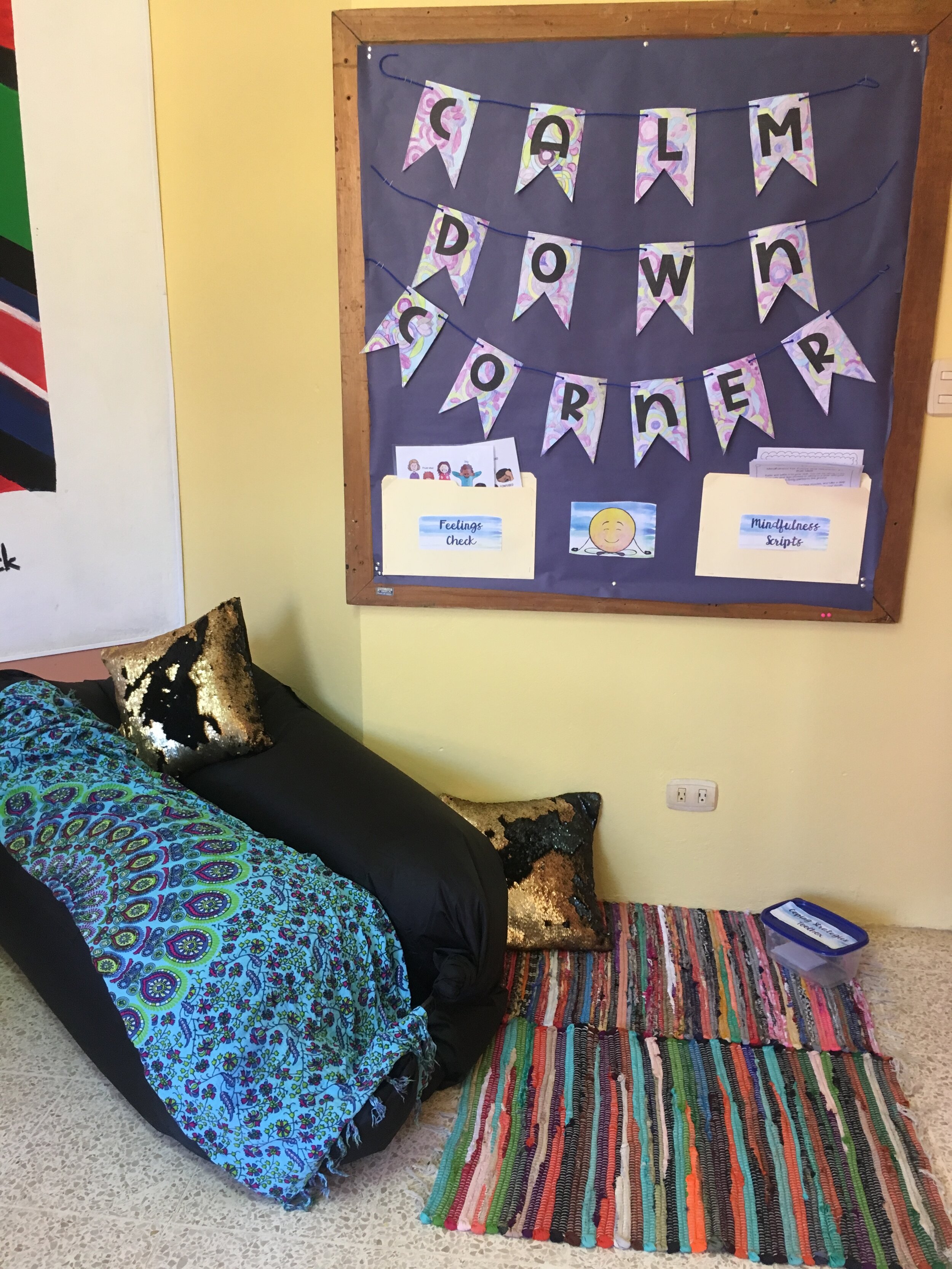 school counseling calm down corner with rugs and pillows