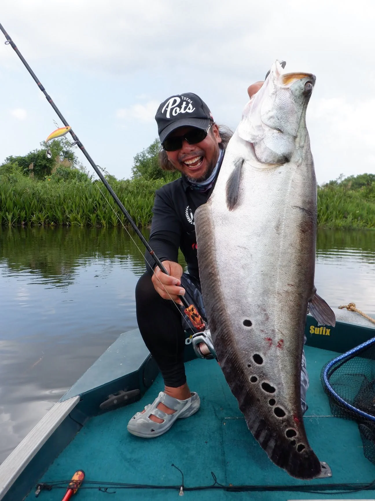 Kozo Okubo fishing featherback bolgoda lake sri lanka.jpg