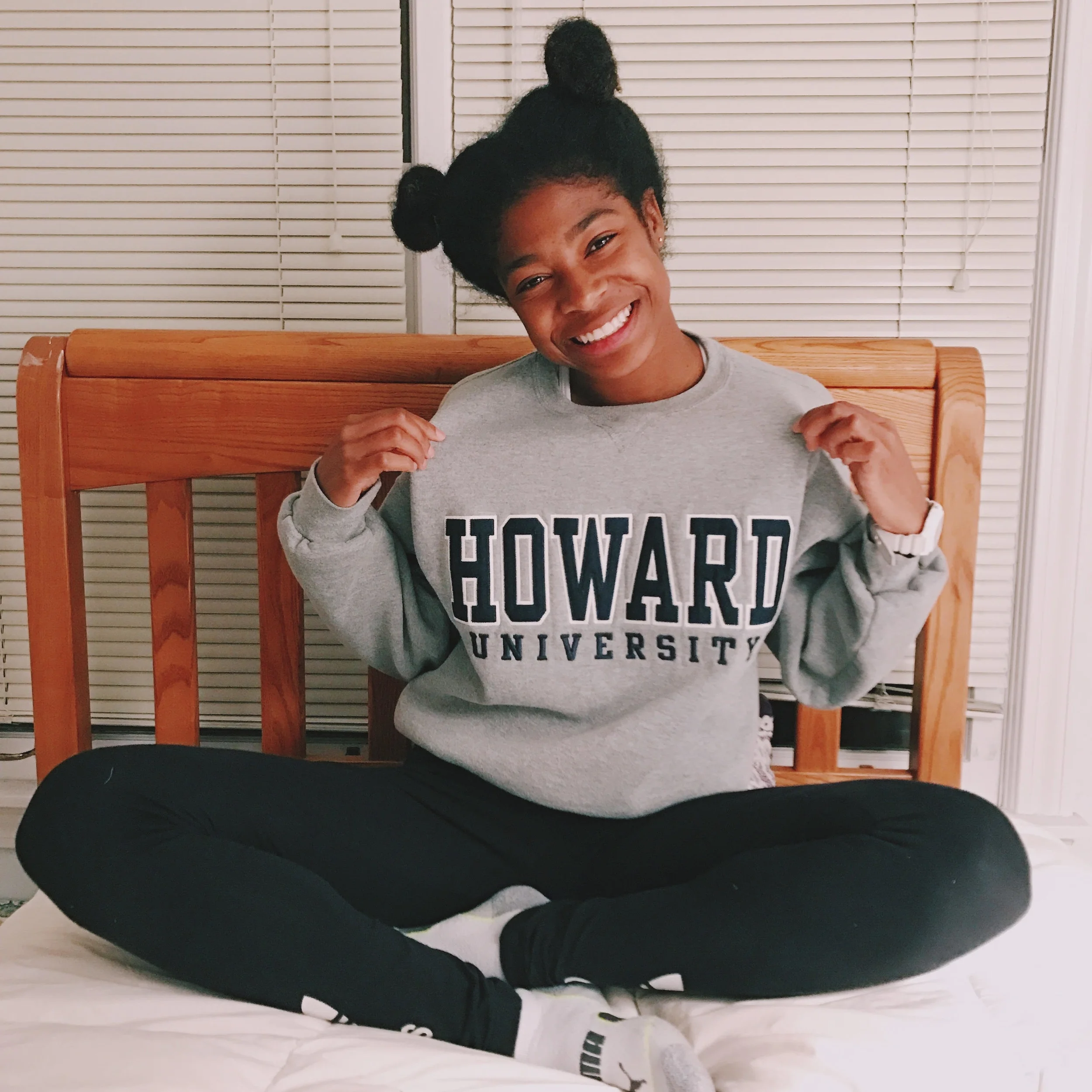 Black girl accepted in HU21 Class wearing Howard University shirt