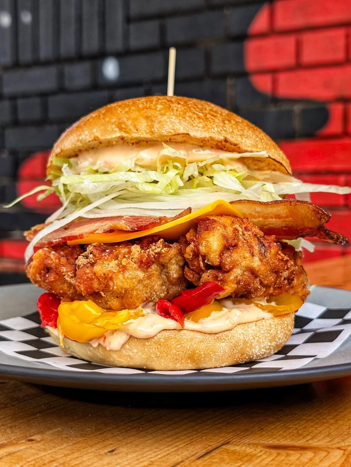 THE PHOENIX🔥🐦&zwj;🔥

FRIED CHKN 🐔 
BACON 🥓 
CHEESE 🧀 
LETTUCE, ONIONS 🥬🧅 
BANANA PEPPERS 🌶️ 
FIVE ALARM MAYO 🚒

Available July 15 - July 19