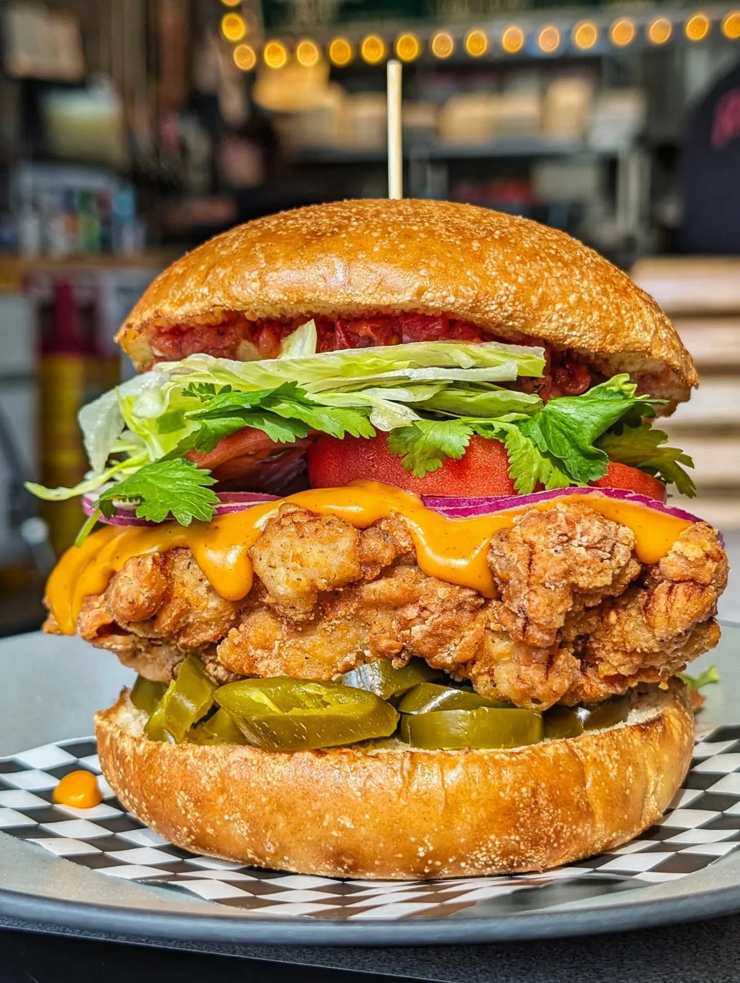 THE EL PASO

FRIED CHKN 🐔 
JALAPENO SALSA, TOMATO 🌶️
ONION, LETTUCE, CILANTRO 🧅
PICKLED JALAPENOS 🌶️
NACHO CHEESE SAUCE 🧀

Available Aug 19 - Aug 23