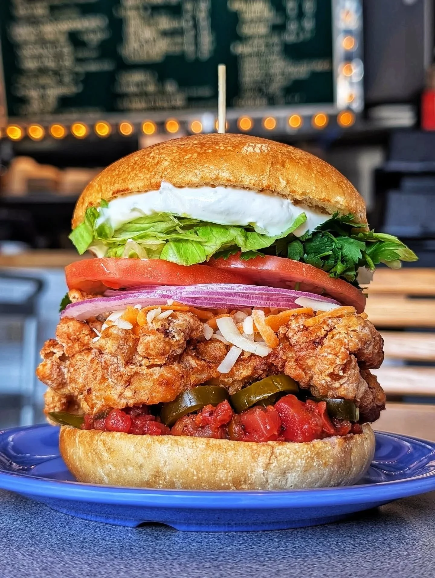 THE OLD EL PASO 

FRIED CHKN 🐔
TACO SPICE, TEX-MEX SHREDDED CHEESE 🧀 
SALSA, TOMATO, RED ONION, LETTUCE 🍅🧅🥬
CILANTRO, PICKLED JALAPENOS 🌶️
LIME CREMA 🍋&zwj;🟩

Available April 7 - 12