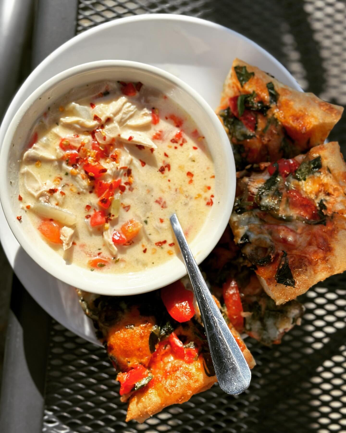 This is our chicken and potato chowder with roasted red peppers and a slice of our house-made pan pizza. It&rsquo;s finally nice enough to eat outside again. Still a bit on the cold side but we have plenty of hot items to choose from to help warm you