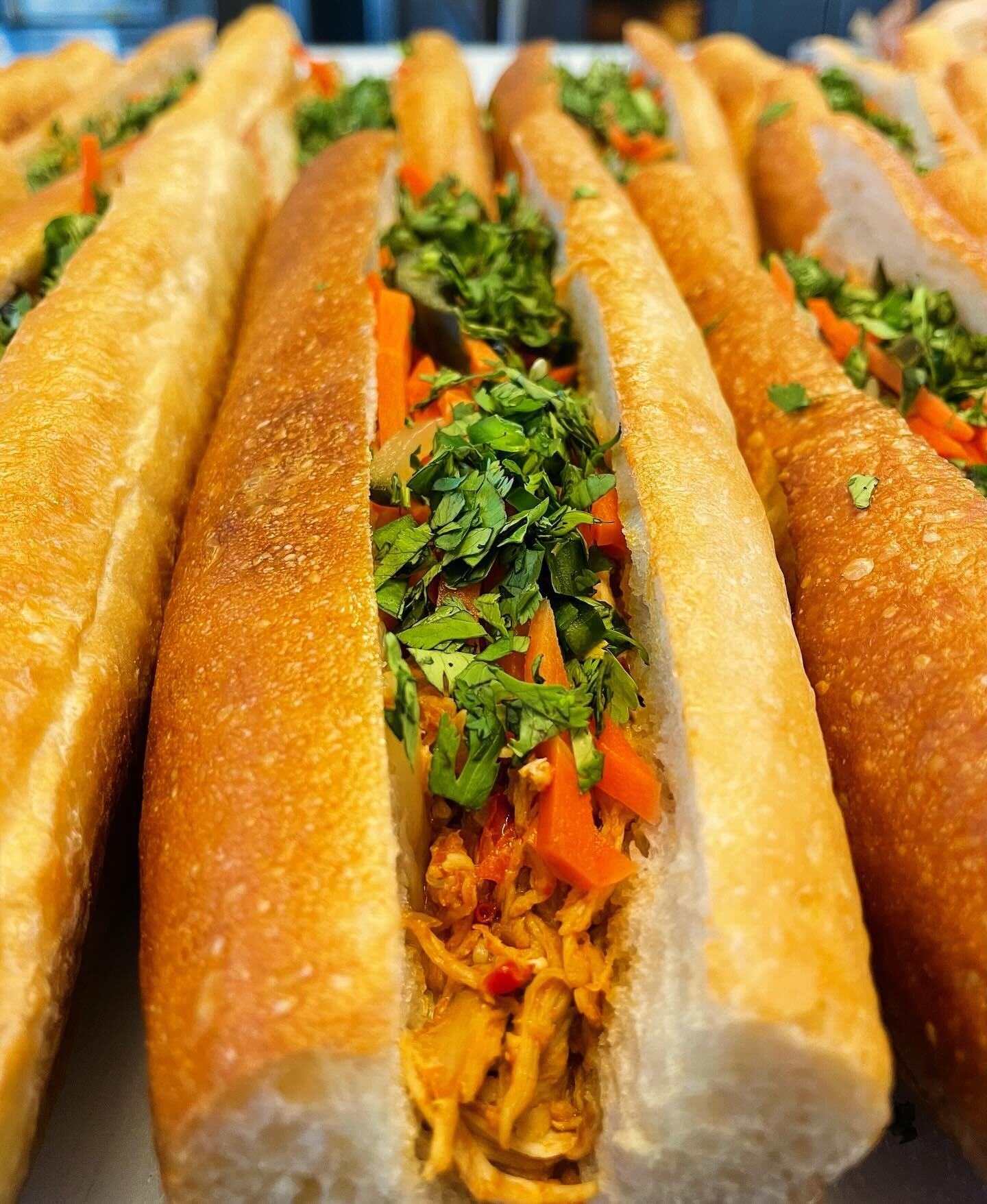 Bahn Mi is back! Roasted chicken tossed in a house made garlic chili sauce, @bluebuscultured kraut-chi, pickled cucumbers &amp; carrots, fresh jalape&ntilde;o, cilantro &amp; mayo on our baguette. We will have a limited amount of them made for grab a