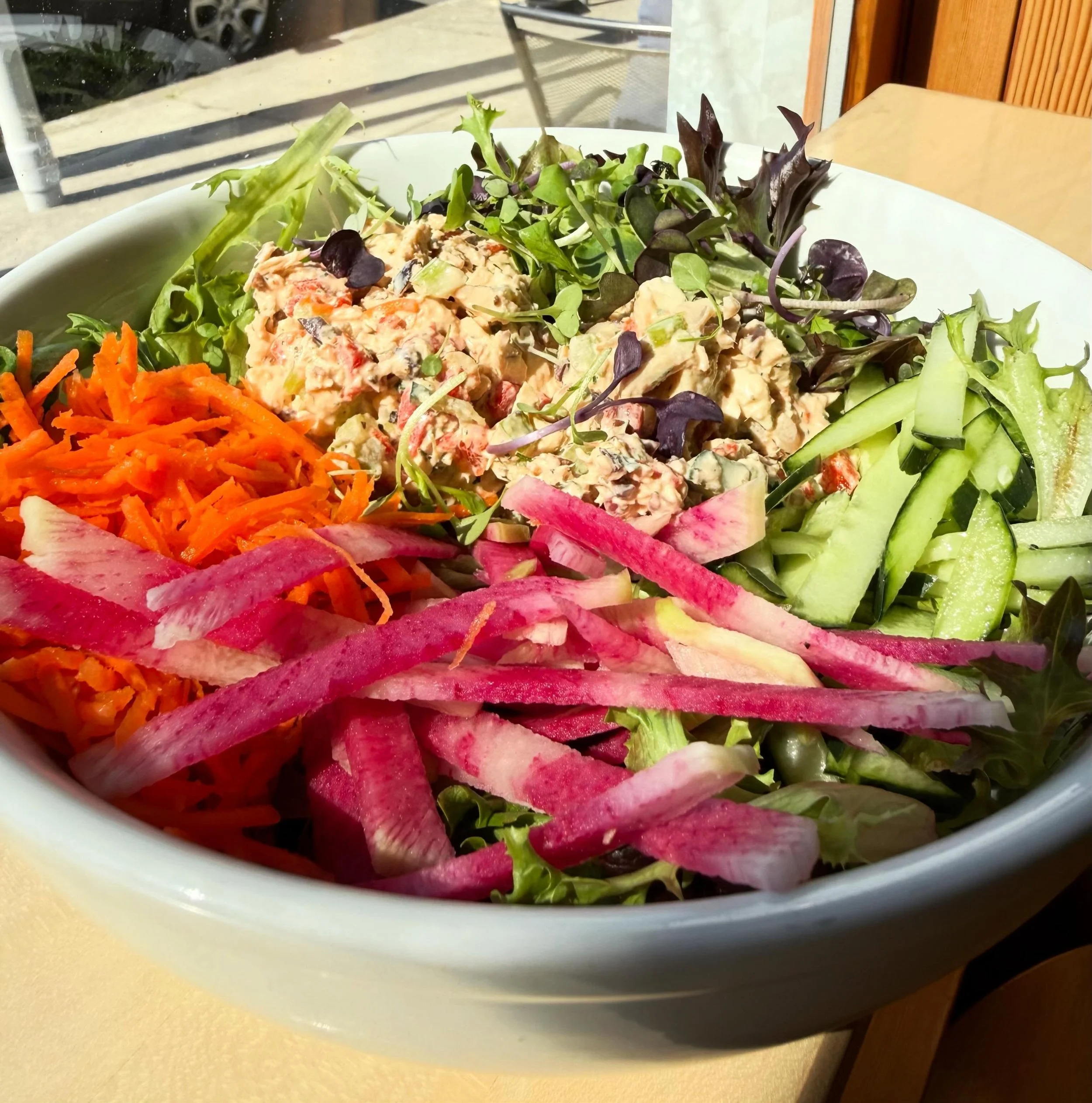 Mediterranean Chicken Salad on greens. Have you tried it? Chicken, kalamata olives, cucumbers, celery, roasted red peppers, red onion, feta cheese all chopped and mixed into our house made greek yogurt dill sauce. The salad comes with locally grown s