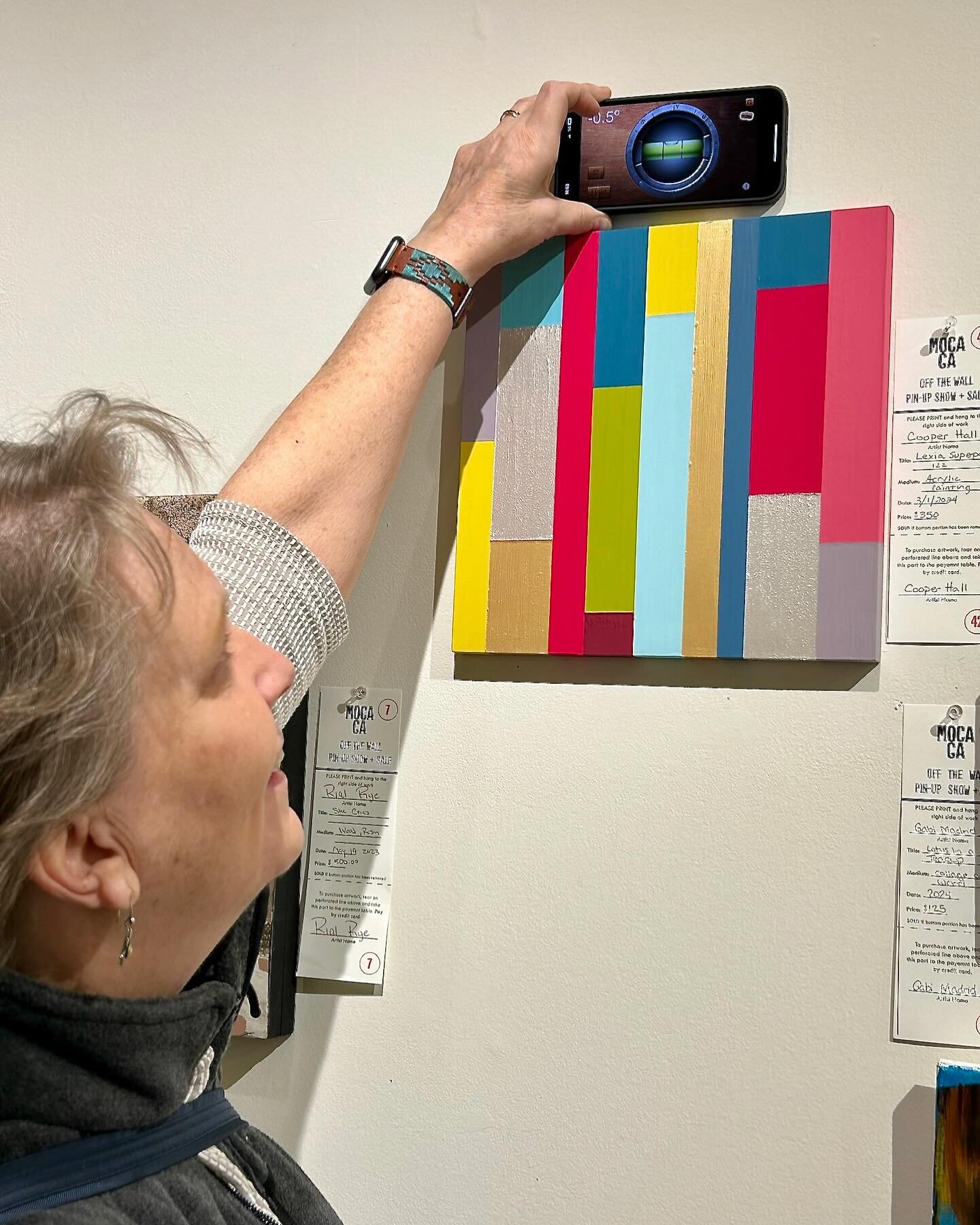 A level app on the iPhone is a great way to hang your art!  Sue recently used the level app when she delivered a piece for client Cooper Hall, an Atlanta artist, to MOCA GA for this week&rsquo;s Off The Wall Pin-Up Show + Sale. @cooperhallart @mocaga