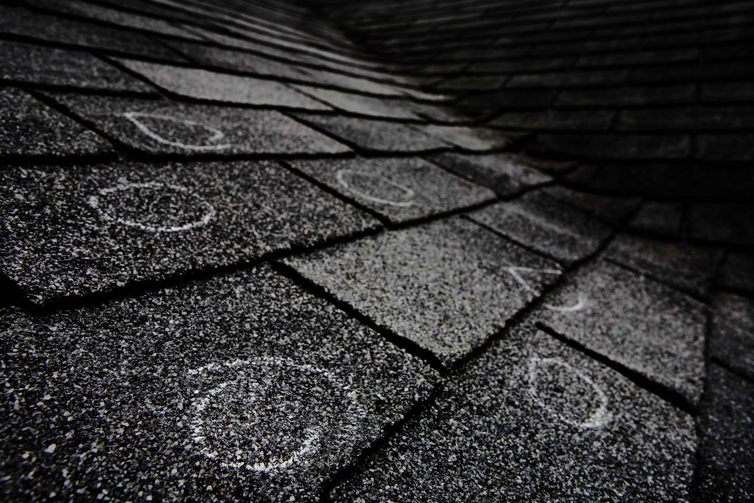 bigstock-Old-roof-with-hail-damage-cha-16442648-2.jpg