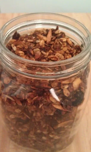 This is my Granola, I like to make it during the holidays. It makes a great gift.
5 cups oatmeal
1 cup sliced almonds
1 cup sunflower seeds
½ cup sesame seeds
1 cup raisins
1 cup dried cherries or any dry fruit (try to find non sulfates)
¼ cup canola oil
1/2 cup -¾ cups honey
Preheat Oven 325 degrees
In a large bowl mix together the oatmeal, nuts and seeds. Stir in the oil and honey. Mix well so the oats are well coated. Place on a cookie sheet and place in the over. Stir every 15 minutes. It will take 45 minutes to an hour. Remove from the oven and stir in the raisins and cherry’s. Cool. Store in a glass jar.