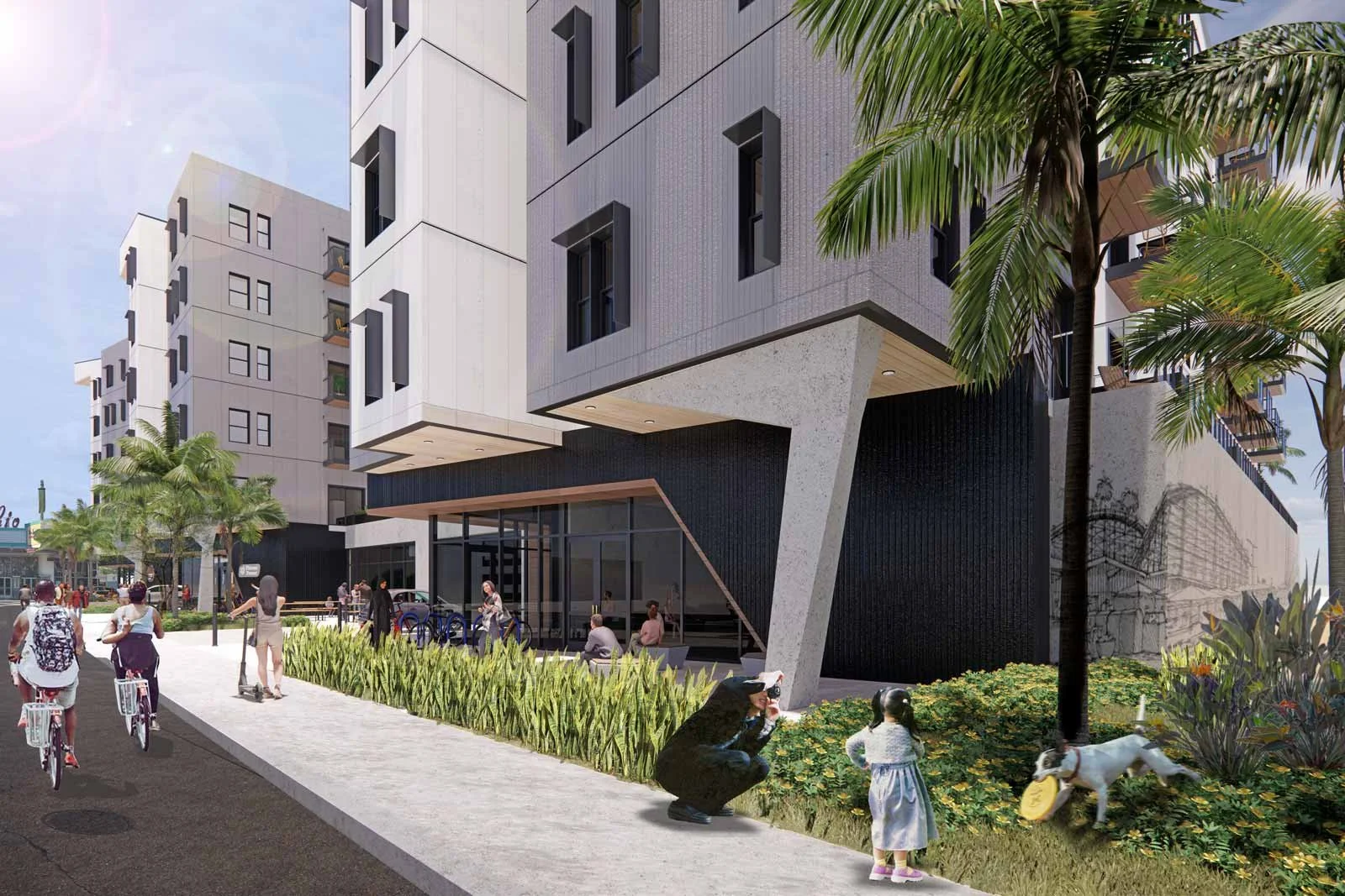 Modern urban building with people walking and cycling on a sidewalk lined with plants and palm trees.