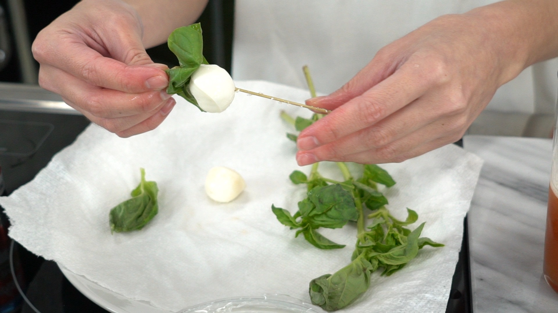 step 8 prepare garnish of basil leaf and mozz ball