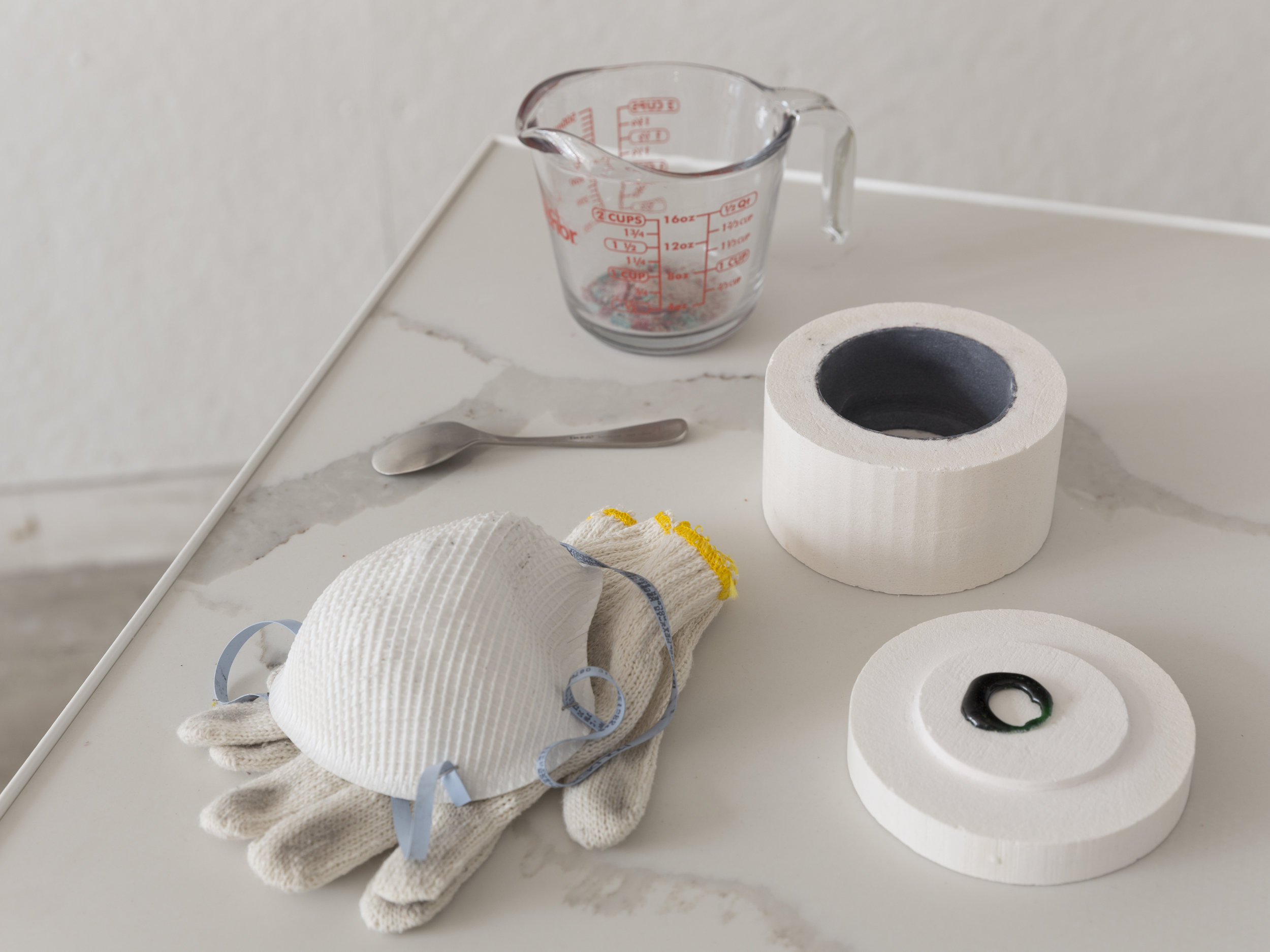 Station 3 detail: objects needed to create microwaveable chakra Microwavable kiln, gloves, dust mask, measuring cup, glass shards, microwaved chakra, spoon , quartz, iron Photo credit: Jonathan Allen