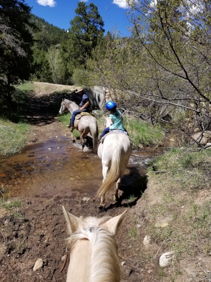 Day one: Crossing over the water on horseback with my little girl.