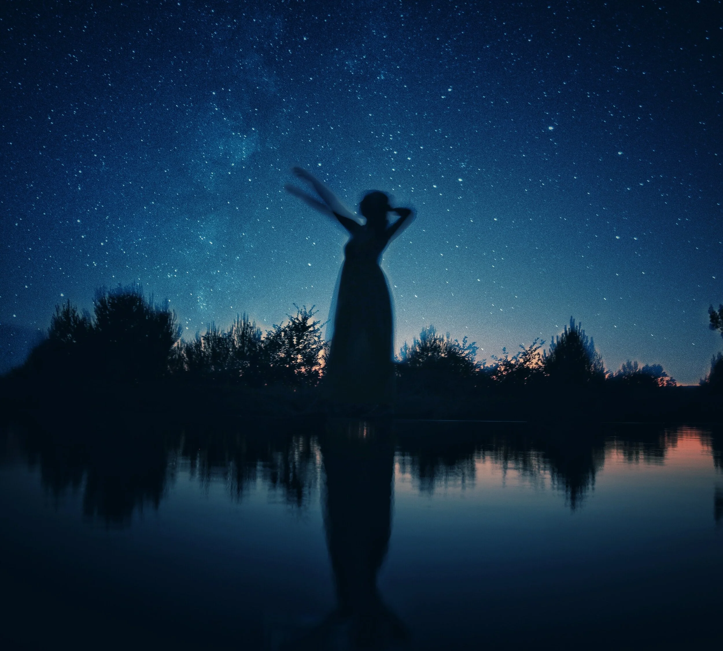 silhouette-of-woman-standing-on-rock-near-body-of-water-3751387.jpg