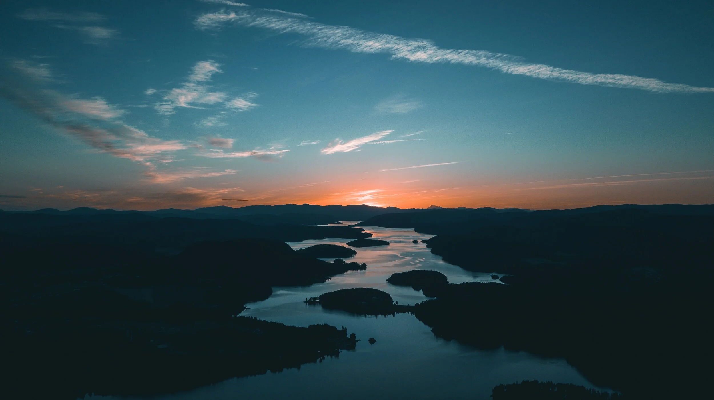 aerial-photography-of-water-beside-forest-during-golden-hour-1144176.jpg