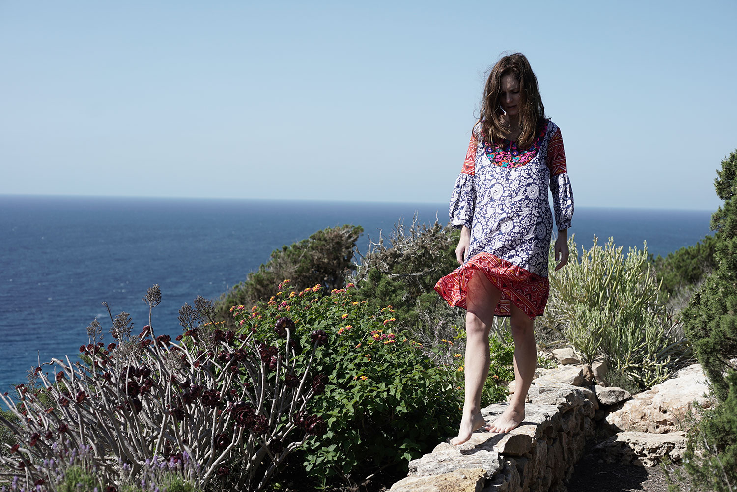 Formentera dress on cliff overlooking ocean