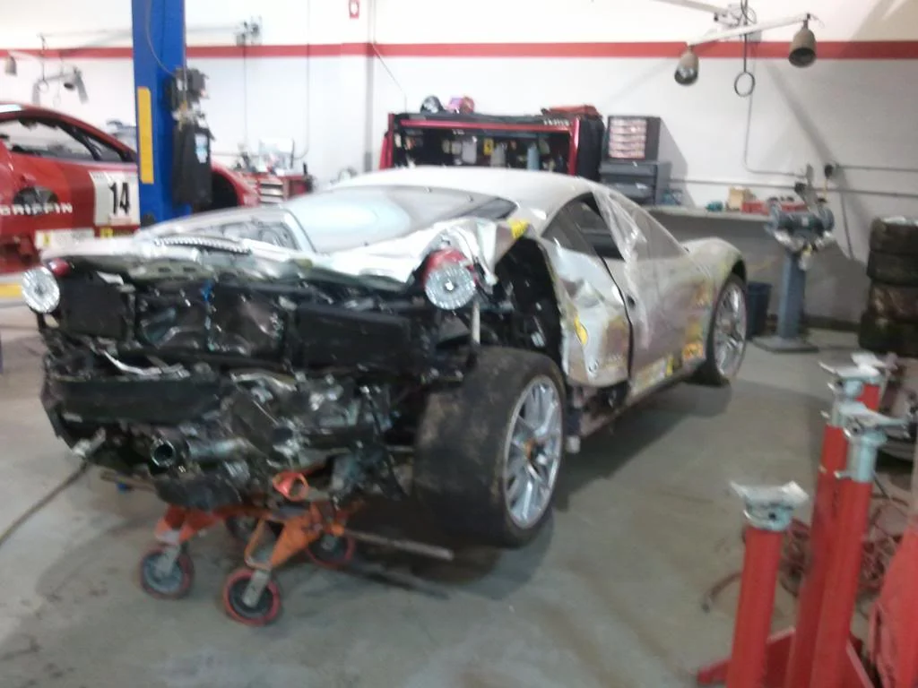 Damaged from being backed into a wall after the driver turned off the traction control.