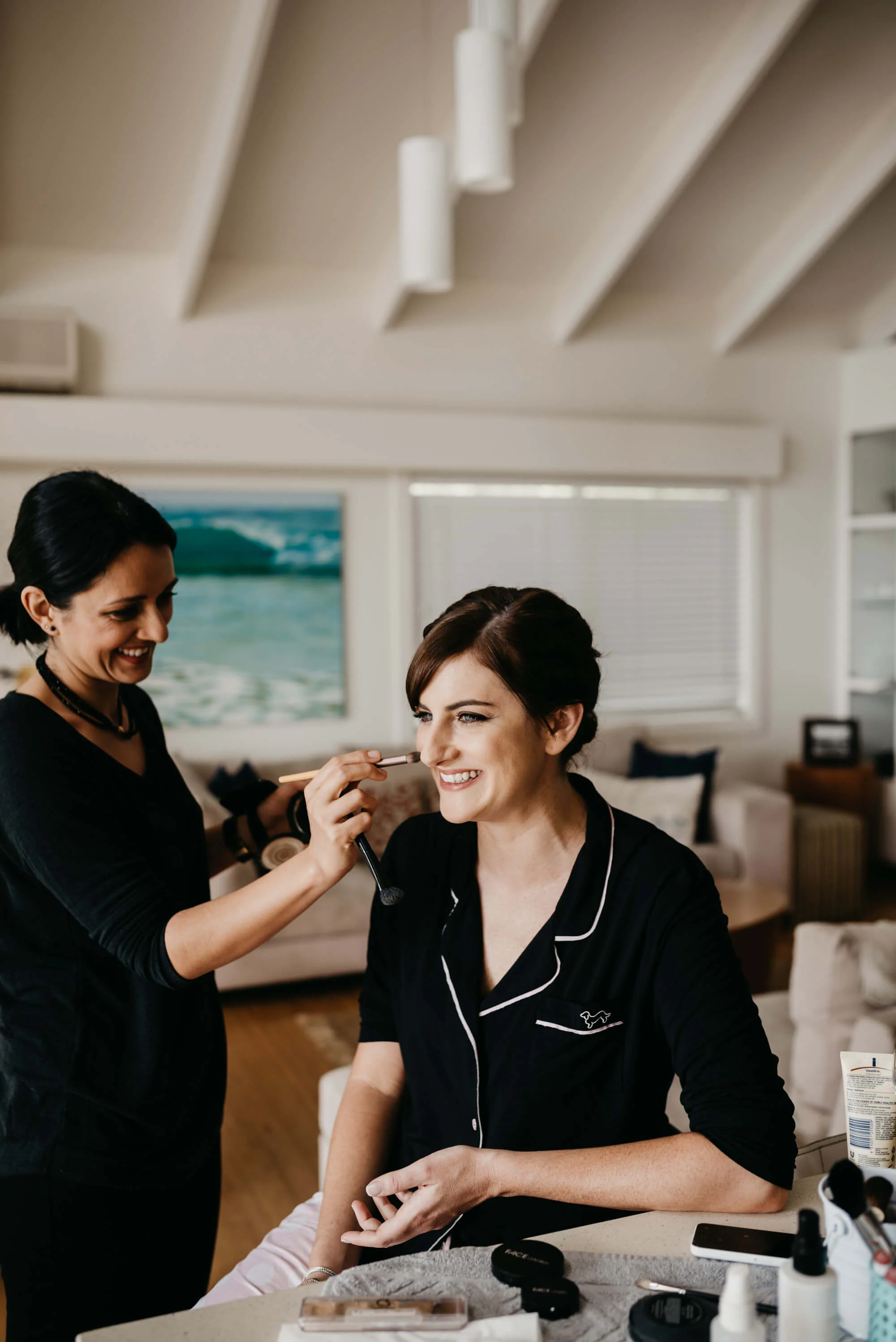 International makeup artist Tasleema Nigh applying professional bridal makeup, demonstrating her 25+ years of mastery and intentional approach for a Sunshine Coast bride.