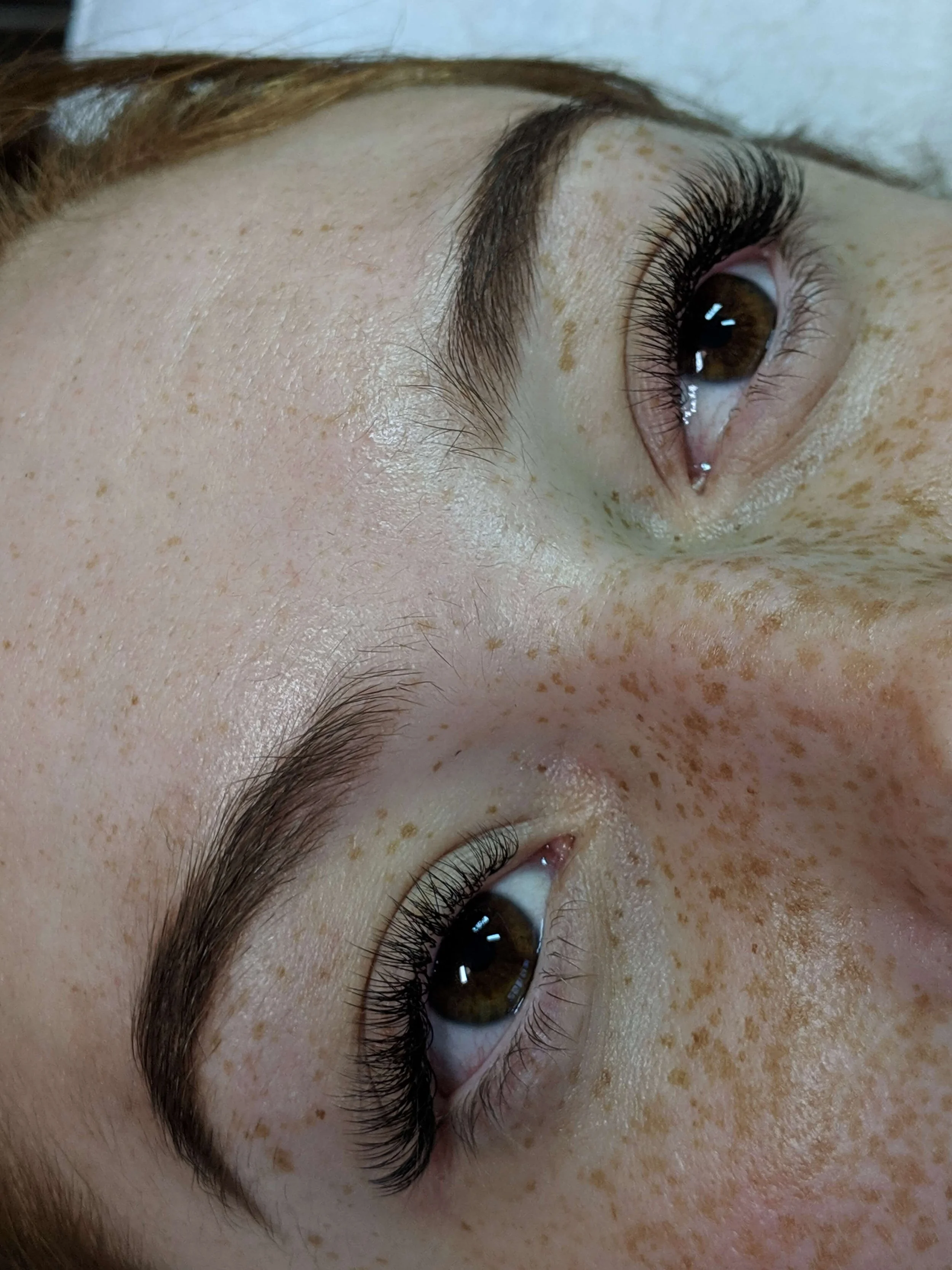 Bespoke lash extensions by Tasleema Nigh. A detailed closeup of a natural and refined lash set, linking to our custom lash design and maintenance services.