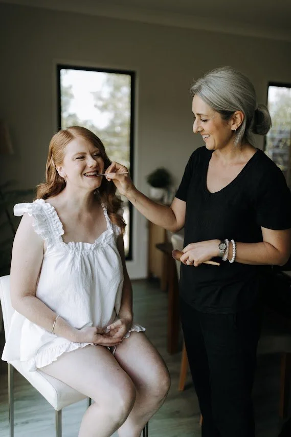 Master artist Tasleema Nigh applying professional makeup, demonstrating the expert precision and 25 years of international experience that informs her bespoke lash designs on the Sunshine Coast.