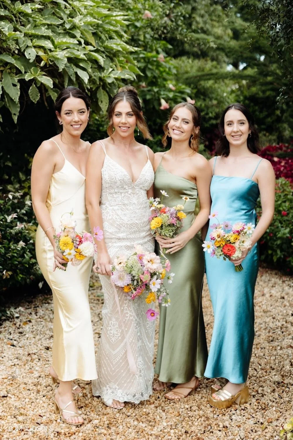 A sophisticated bridal party in Bridgerton-style dresses featuring professional regency-inspired makeup by a Sunshine Coast bridal specialist.