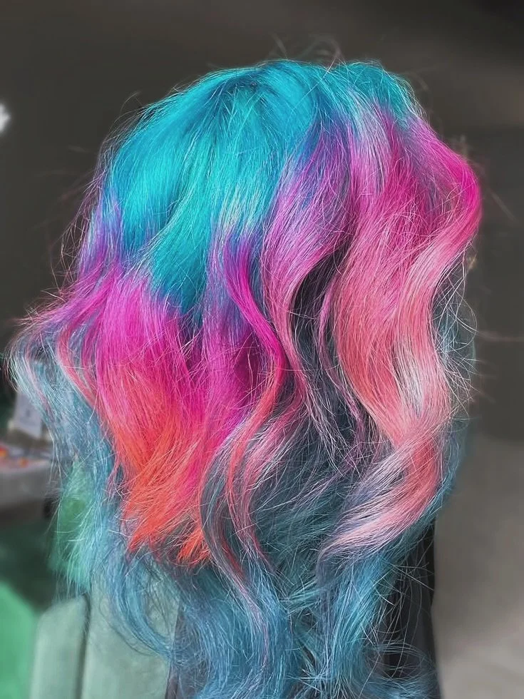 Electric Cotton Candy ⚡️🍬
This hair is giving all the summer night - state fair - neon lights &amp; cotton candy vibes. 
We love a good tousled tresses look but swipe>> to see it smoothed out.
HAIR by @your.hair.angel.a 
#HOFSalon
#HausOfFlint