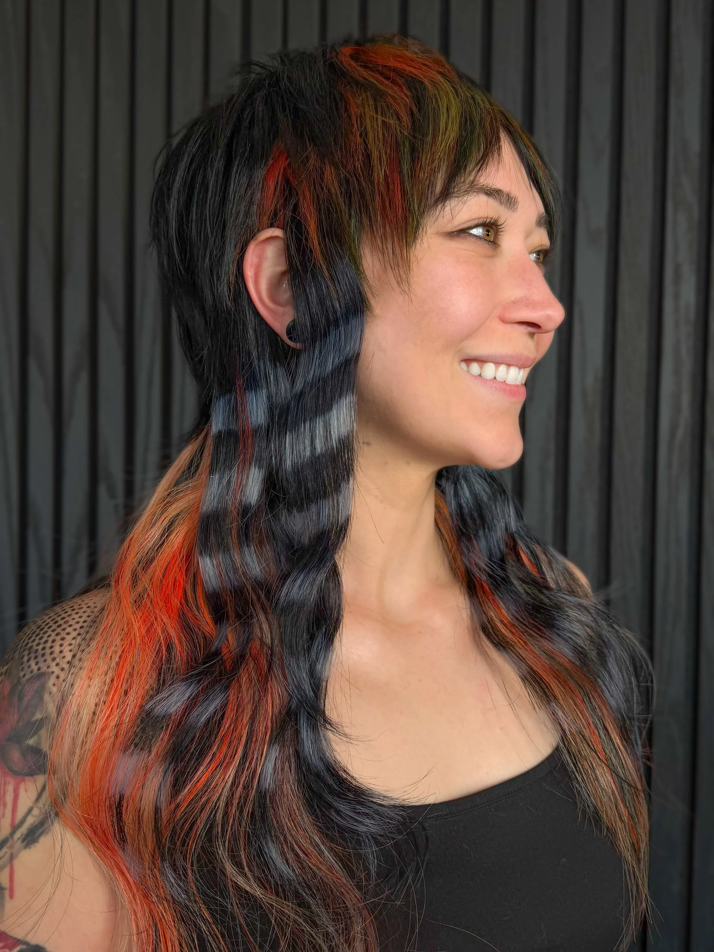 Tis&rsquo; the Season for Dope Hair 🎃🦇🦝👻✨
HAIR by @dallanxhof 
Protected and styled w/ @oligclub 
Creative Space - HOF Salon
DOPE Human &amp; Tattoo Artist @_kawaitattoo 
.
.
This picture shows a creative color, punk aesthetic, mullet textured cu