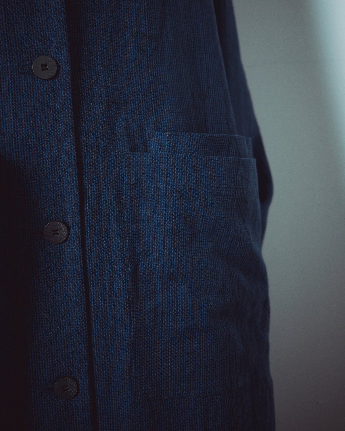 Muku SS26 - Indigo Gingham Patterned Long Coat - Pocket detail