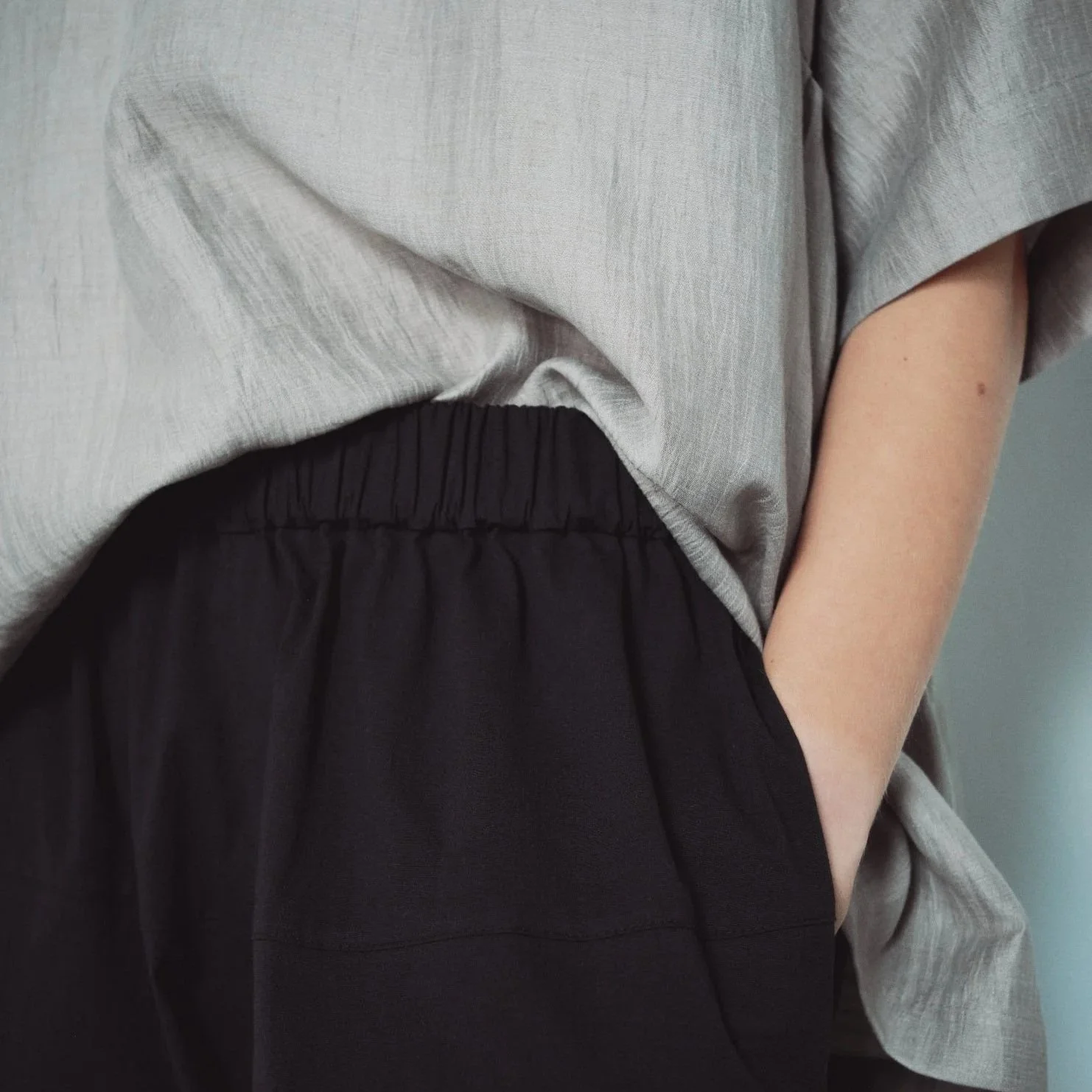 Muku SS26 - Black Cotton Tapered Trousers with Back Pockets