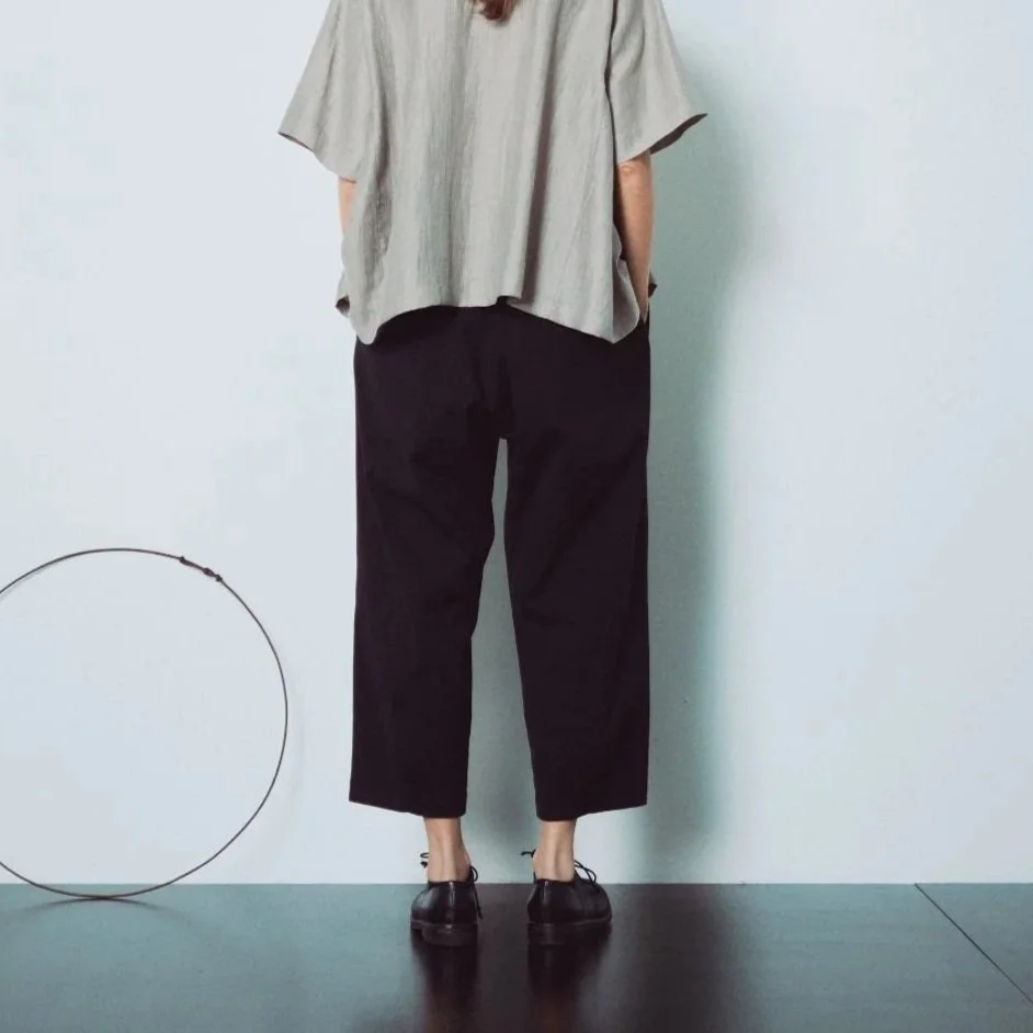 Muku SS26 - Black Cotton Tapered Trousers with Back Pockets