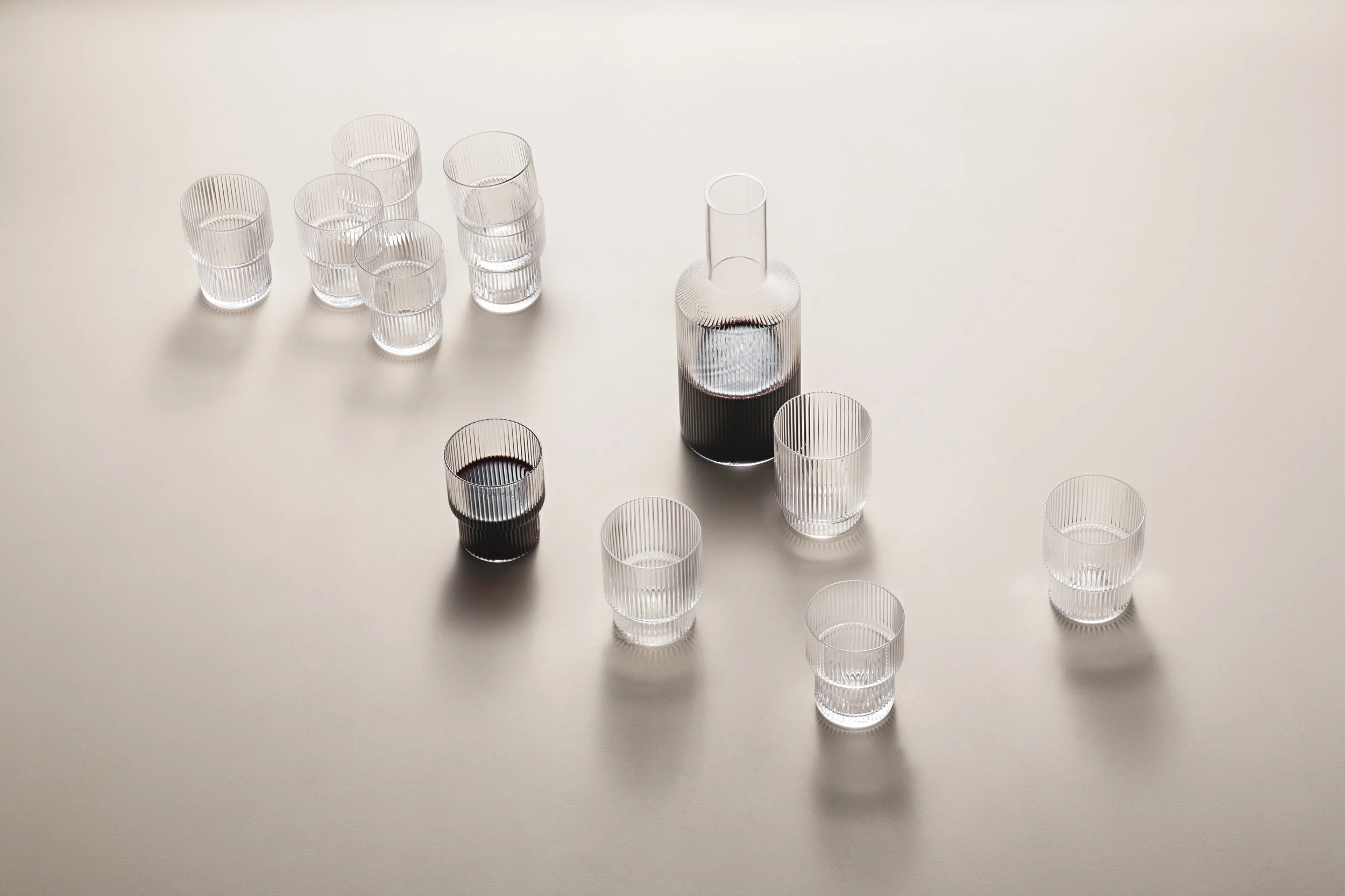 Ripple Glasses and Carafe. Mouth-blown into the mould. Set of 4 glasses with a stackable design.