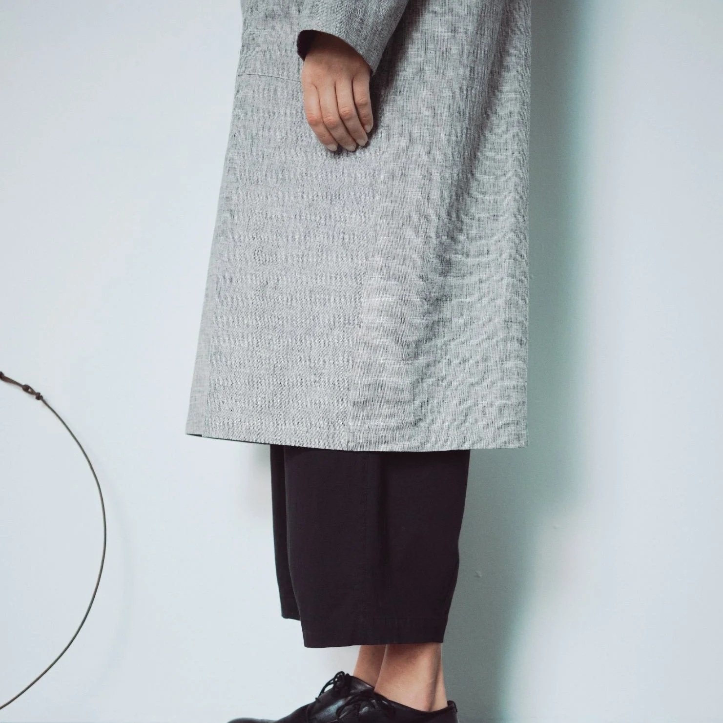 Muku SS26 - Light Grey Patterned Long Coat - Hem Detail
