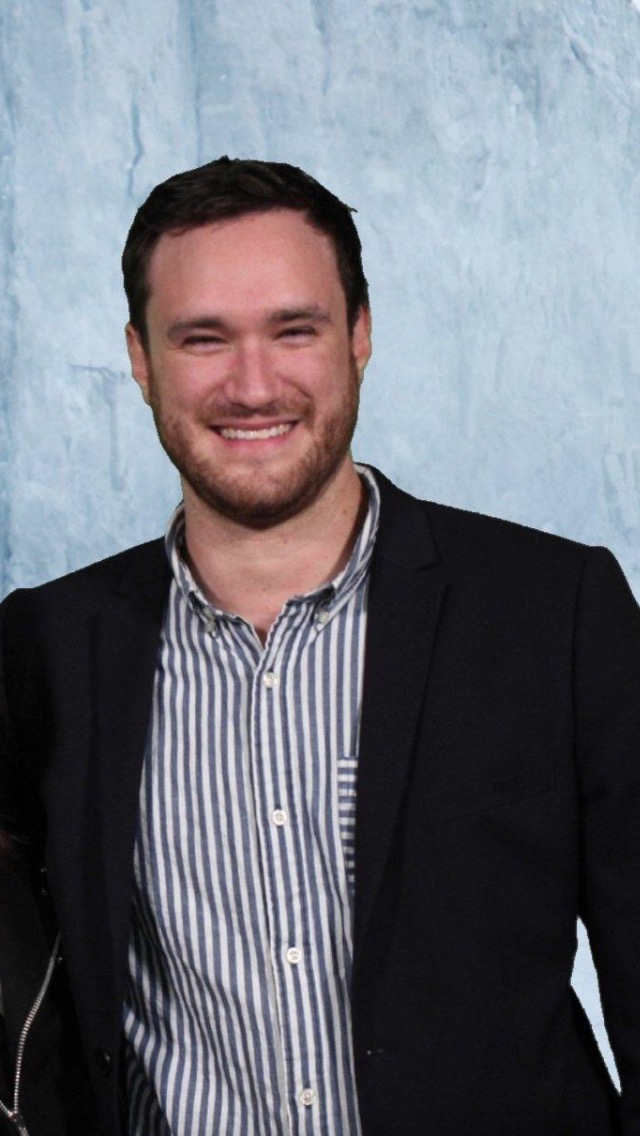 D. F. Lovett with the Wall behind him.