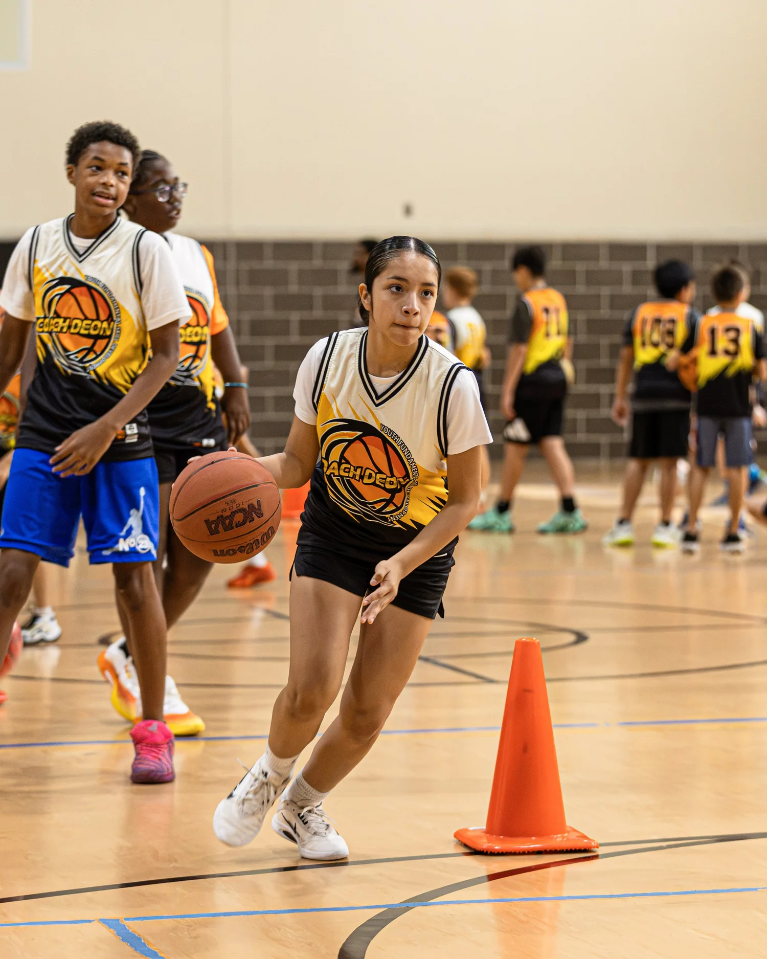 Coach Deon Basketball summer camp players training together in The Woodlands