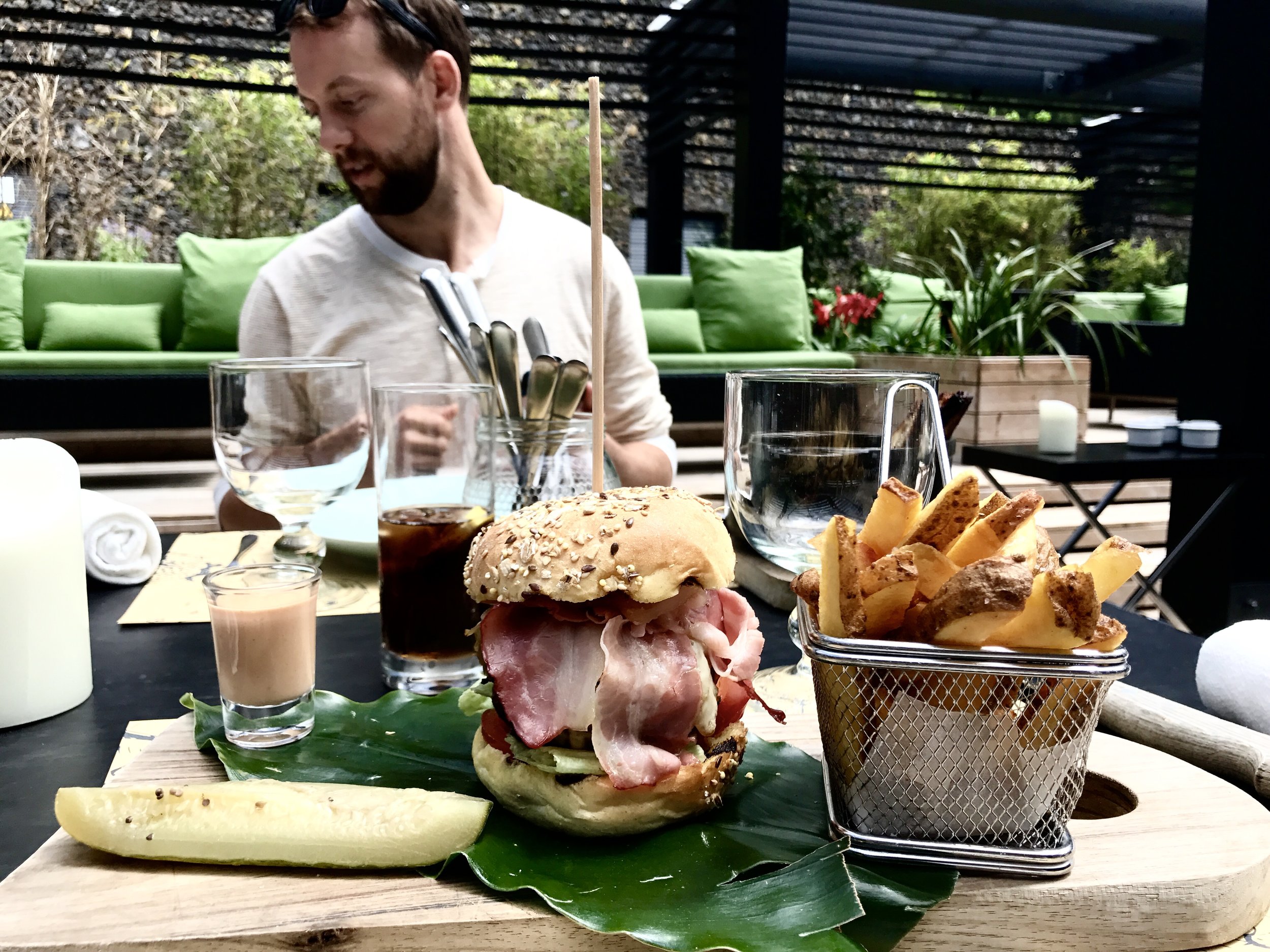 First meal in Portugal. Kyle in the background freezing for a bee.