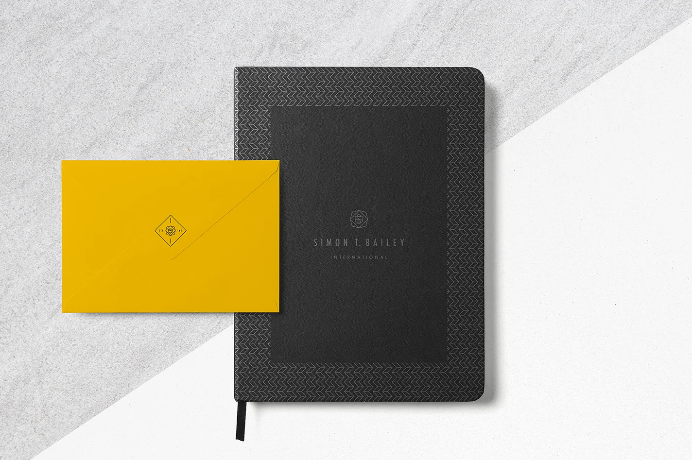 Black journal stationary with envelope on grey (from brand board)